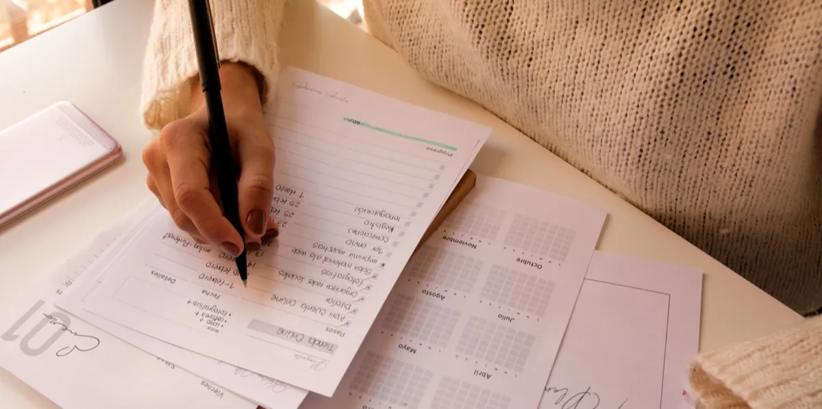 Two people reviewing paperwork together at a table