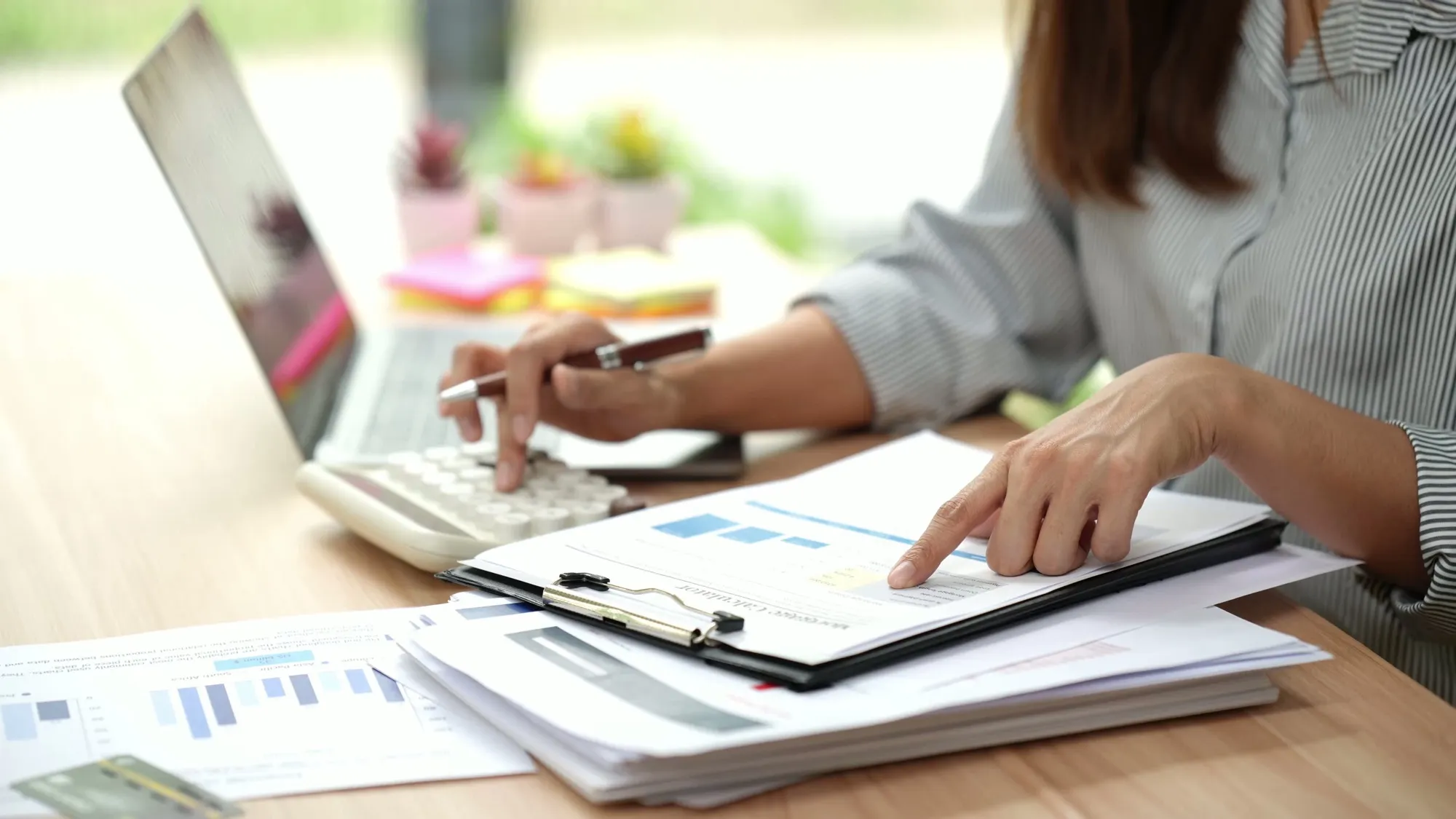 Two people reviewing paperwork together at a table