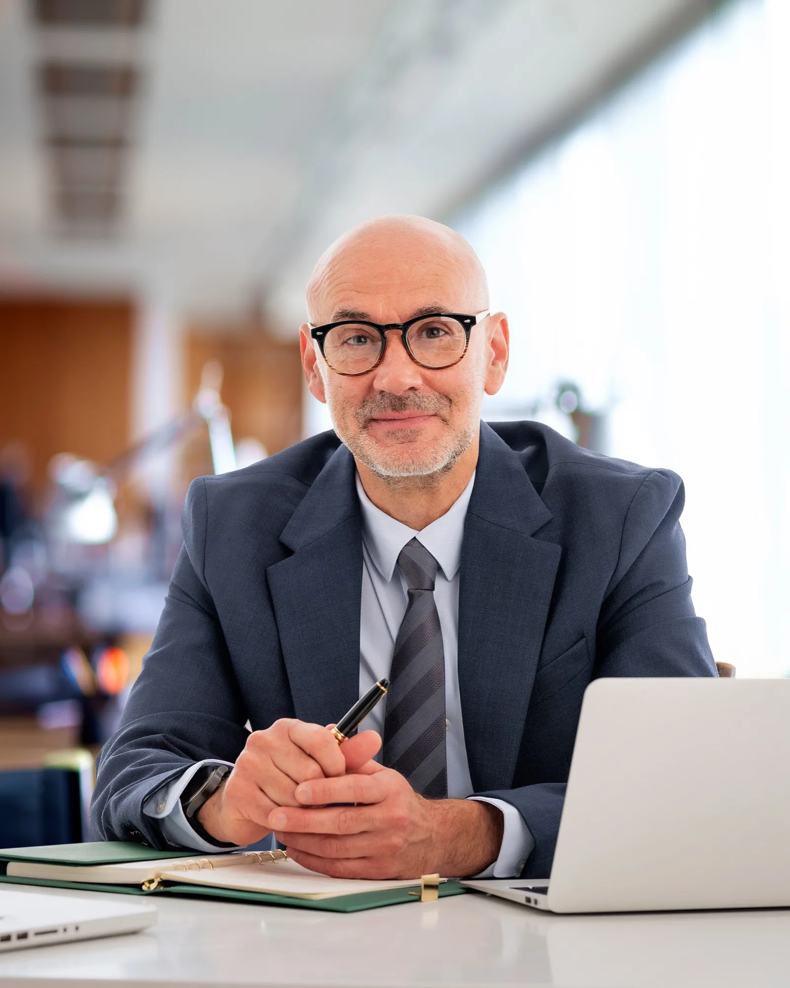 A tax professional reviewing documents at a desk